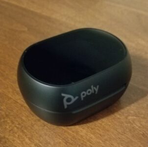 The Poly Voyager Free 60+ UC earbuds in their closed case