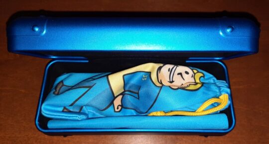 Opened Fallout Vault 33 GUNNAR glasses case, with the glasses and microfiber ouch inside